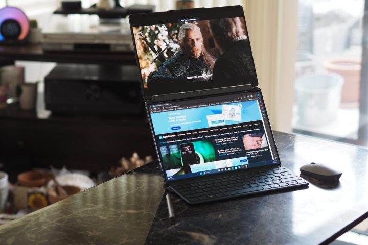 alt: Lenovo Yoga Book 9i dual vertical screens in the origami stand.