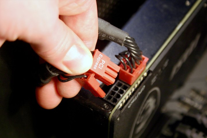 Power cables being attached to a GPU.