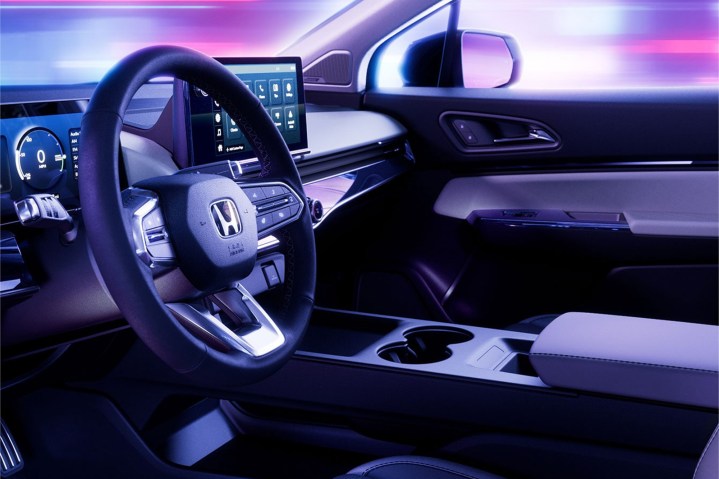 alt text: Interior view of the 2024 Honda Prologue highlighting the dashboard, infotainment screen, and steering wheel.