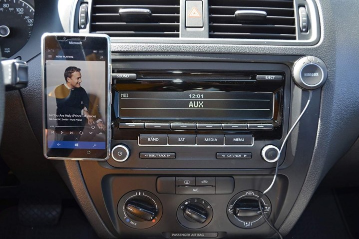 alt: A Himbox Bluetooth device for adding Bluetooth to a car.