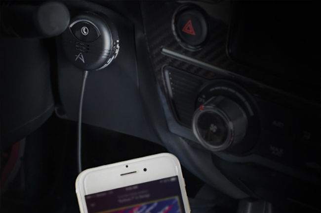 alt: A vehicle-specific Bluetooth adapter for integrating with a factory car stereo.