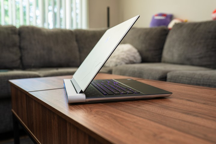 The side of the Alienware x16. Alt text: Side profile of the Alienware x16, highlighting its thin chassis and curved edges.