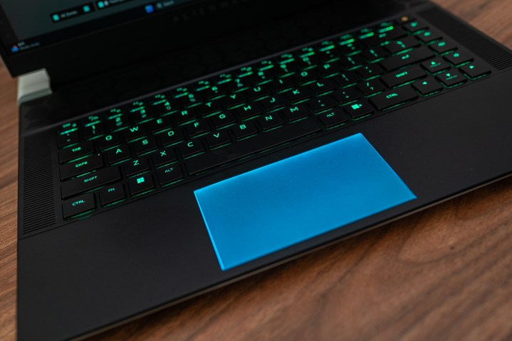 Trackpad on the Alienware x16. Alt text: Close-up view of the Alienware x16's RGB touchpad, showcasing its customizable lighting effects.