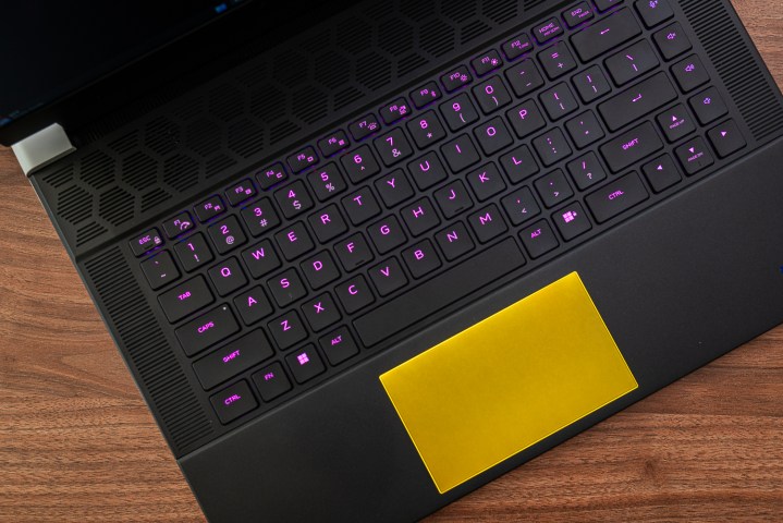 Keyboard and trackpad on the Alienware x16. Alt text: Close-up of the Alienware x16's keyboard and trackpad, highlighting their design and layout.