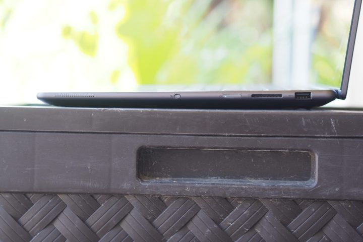 Lenovo Slim Pro 9i side view showing ports and lid.