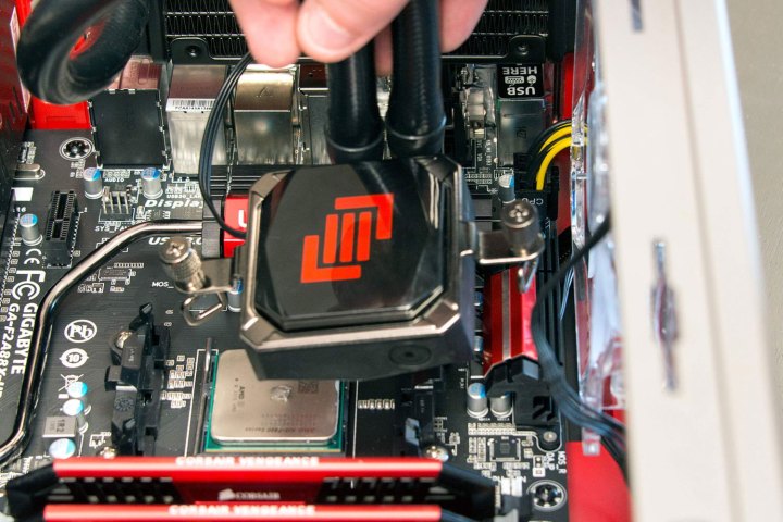 Alt: Applying thermal paste to the AMD CPU.