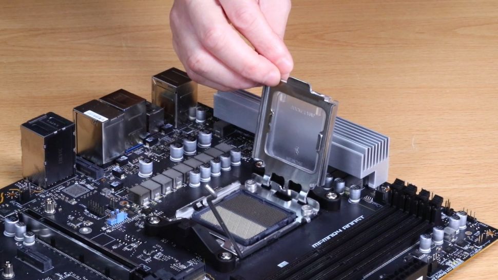 Alt: Opening the CPU socket lever on an AMD motherboard.