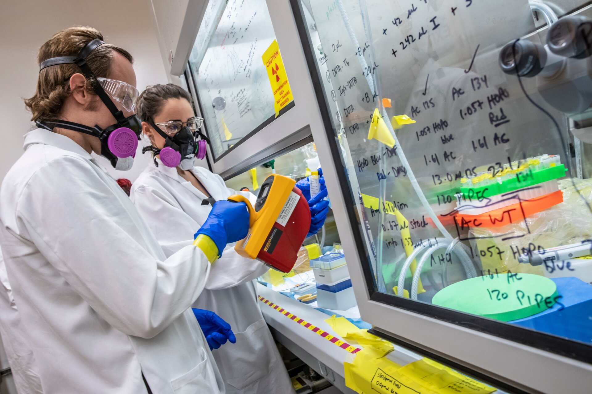 Chemists inspect a lab sample of einsteinium-254.