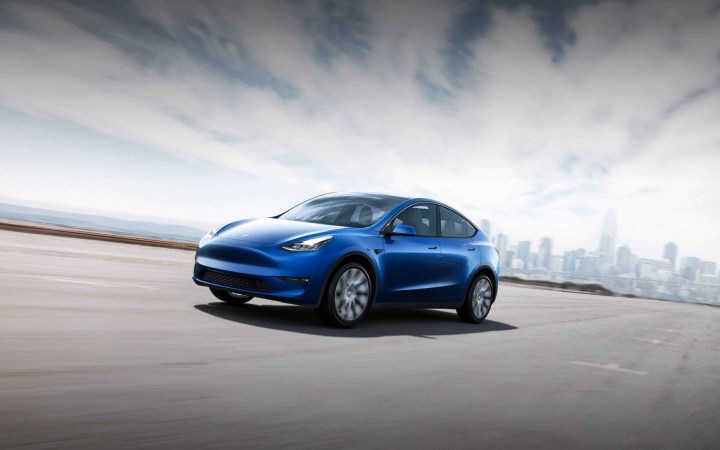 Alt: A Tesla Model Y electric crossover parked in a driveway.