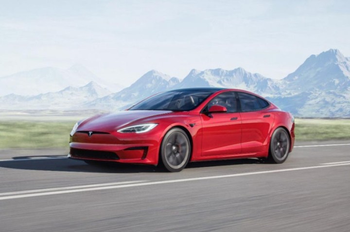 alt text: A 2021 Tesla Model S sedan parked in front of a modern building.