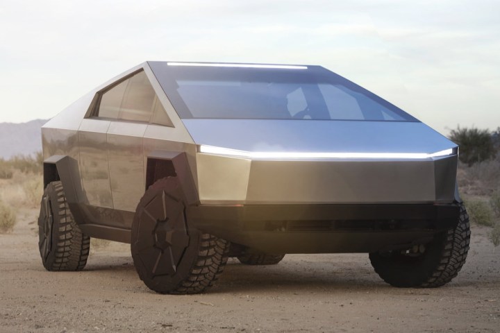 alt text: A close-up view of the Tesla Cybertruck showcasing its stainless steel body and unique angular design.