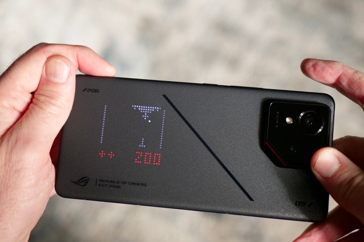 A person playing the AniMe Vision games on the Asus ROG Phone 9 Pro.