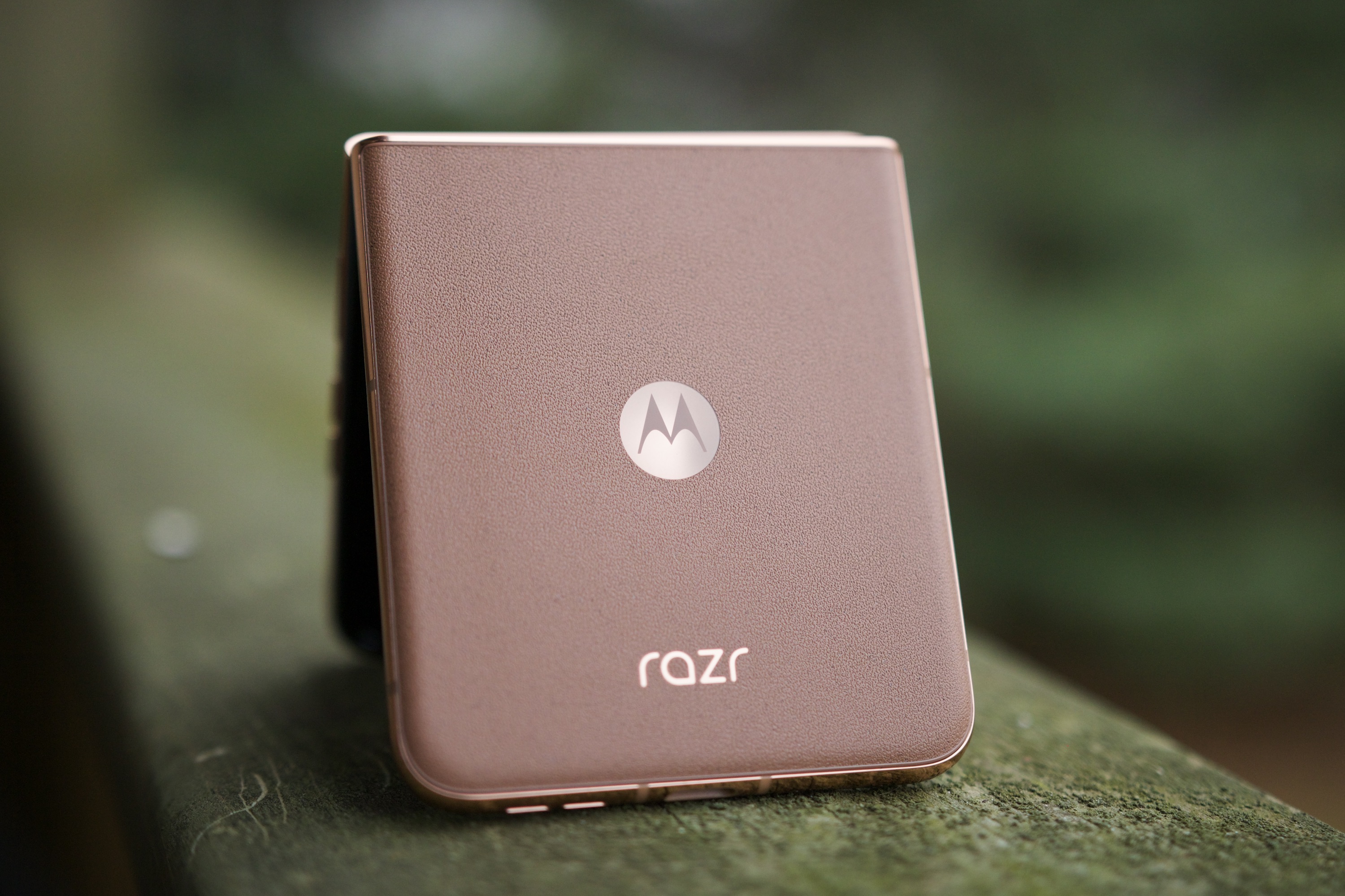 alt: The back of the Mocha Mousse Motorola Razr Plus 2024 held in hand, emphasizing its real-world appeal.