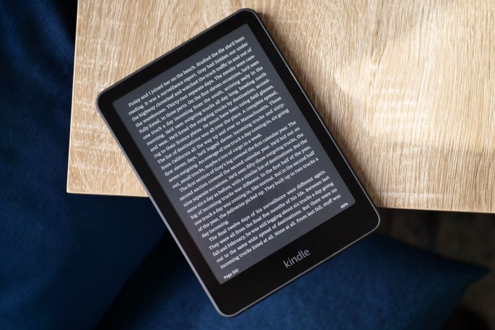 The Amazon Kindle Paperwhite 2024 with Dark Mode active on a book page.