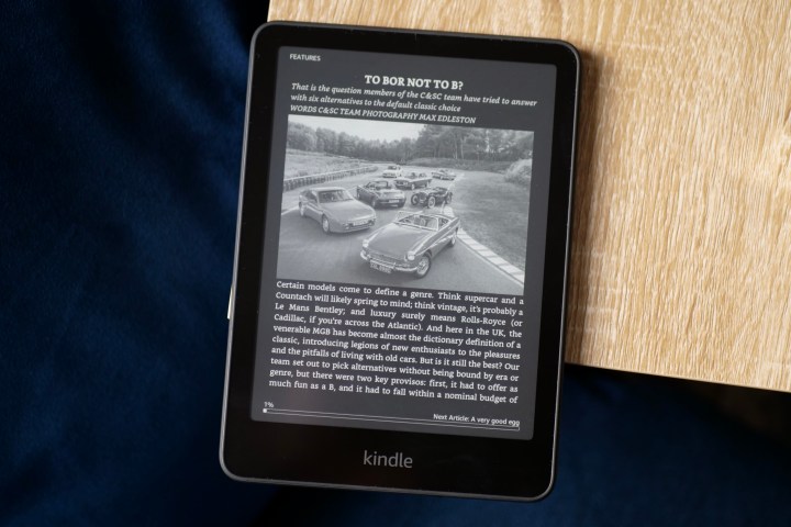 The Amazon Kindle Paperwhite 2024 with Dark Mode active on a magazine page.