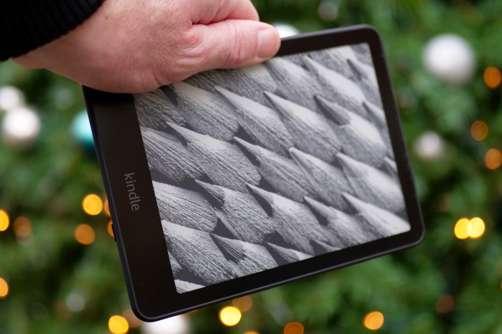 A person holding the Amazon Kindle Paperwhite 2024.