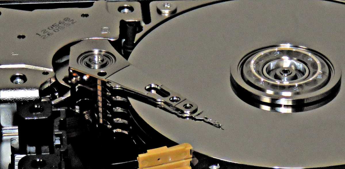 alt text:  A close-up image of a hard disk drive (HDD).  Clicking sounds from an HDD indicate potential drive failure and require immediate data backup.