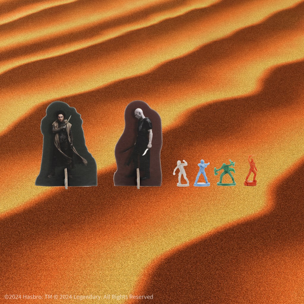 alt: Detailed view of character standees for Paul Atreides and Feyd-Rautha in Risk: Dune.