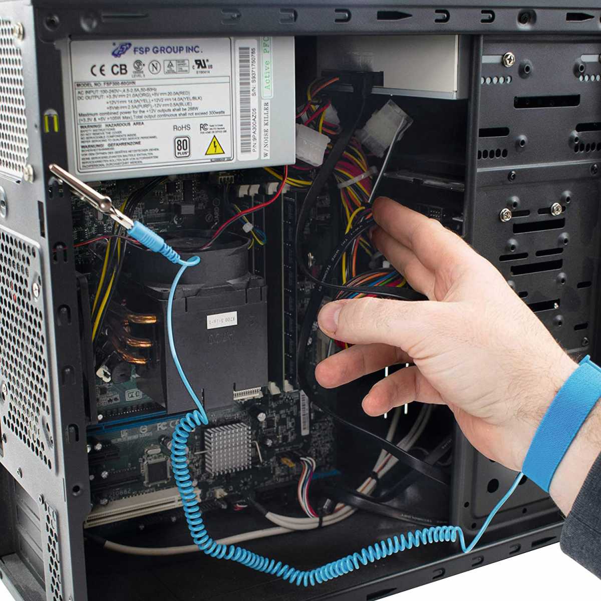 alt text:Close up of computer components including a motherboard. Static discharge can damage sensitive PC parts. An anti-static wrist strap or grounding yourself before working on components can prevent this.