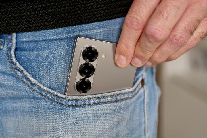 A person taking the Samsung Galaxy Z Fold 6 out of a pocket.