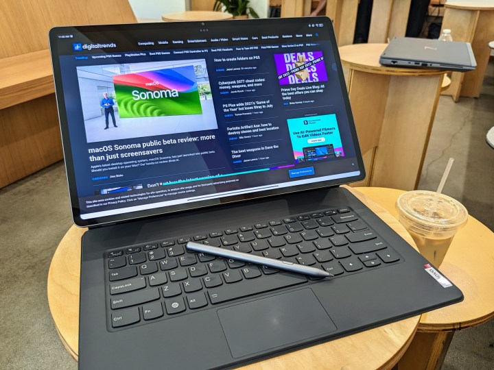 alt: A desk setup with a Lenovo Tab Extreme, keyboard, and mouse, highlighting the need for external accessories for productivity.