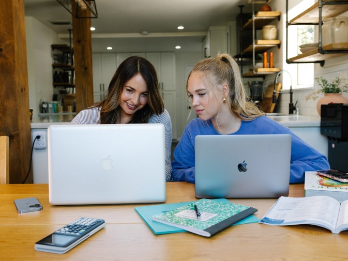 Mom and daughter focusing on back to school security tips- 1Password