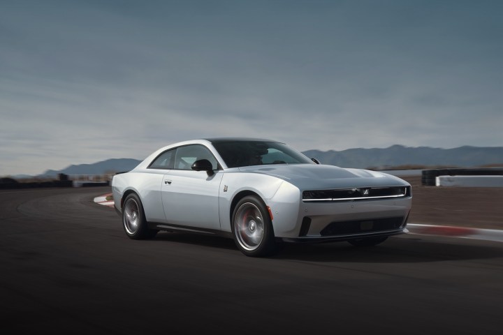 alt: Front three quarter view of the 2024 Dodge Charger Daytona coupe, showcasing its retro design and R-Wing.