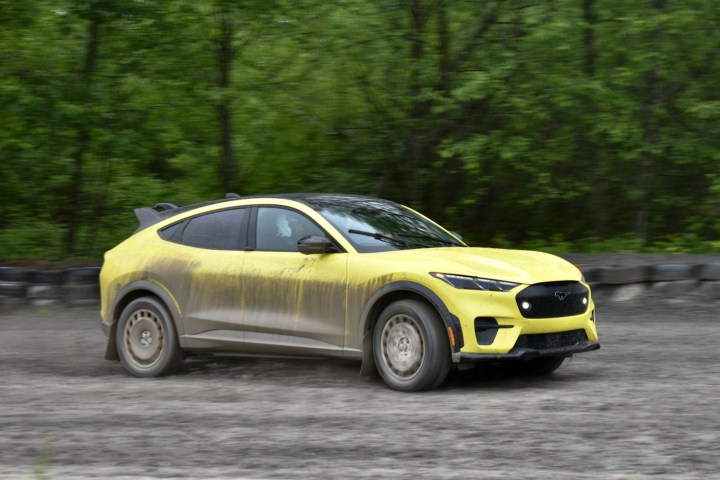 2024 Ford Mustang Mach-E Rally driving on dirt.