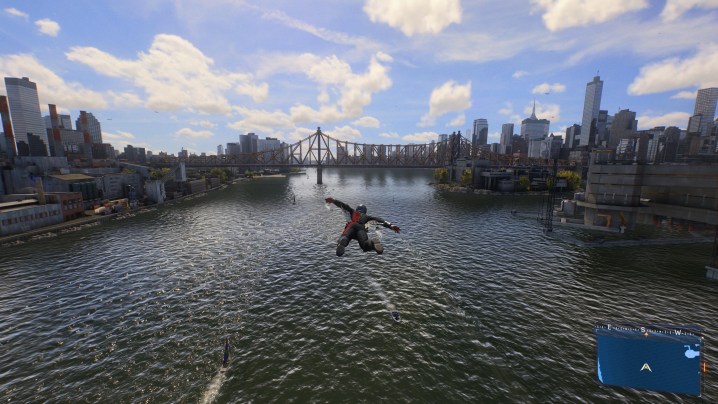 Spider-Man soars over a river in Marvel