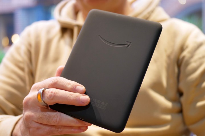 A person holding the Amazon Kindle Paperwhite 2024.