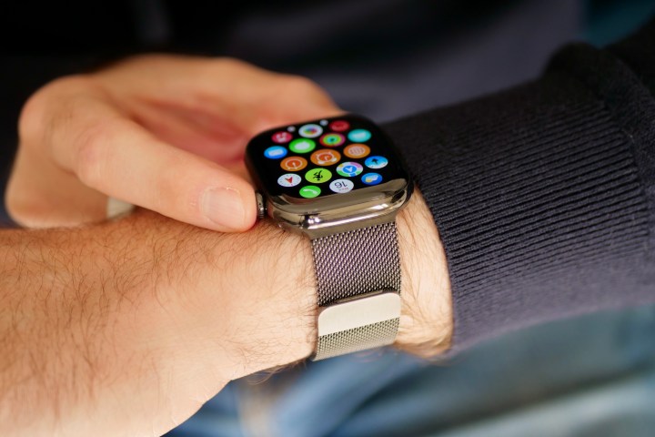 A person wearing the titanium Apple Watch Series 10.