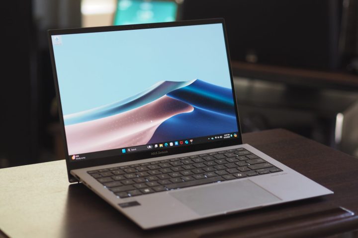 alt text: Asus Zenbook S 13 OLED angled view showcasing its slim profile, keyboard, and touchpad.