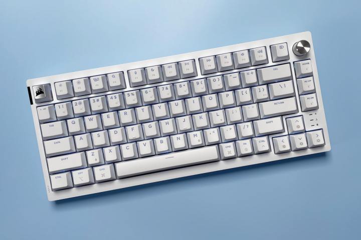 The Corsair K65 Plus for Mac keyboard against a blue background.