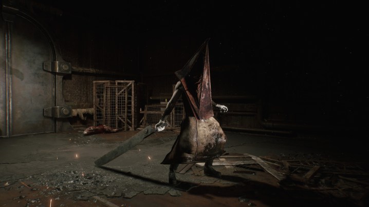 Pyramid Head wields a weapon in Silent Hill 2.