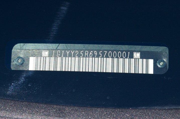 alt text: A car's VIN number located at the base of the windshield