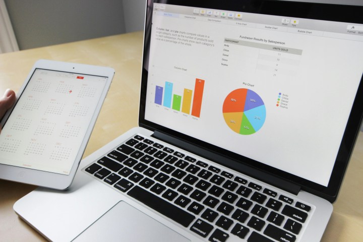 alt: A laptop displaying a spreadsheet with a graph, showcasing the use of AI in spreadsheets.