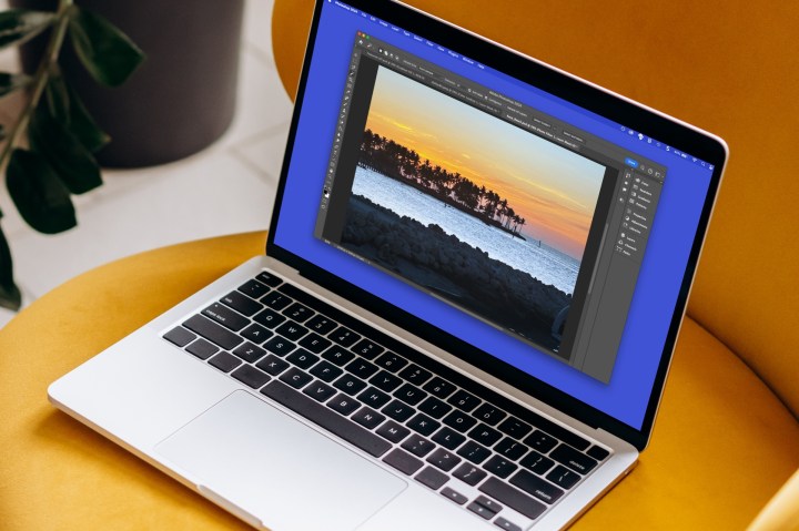 alt: A person editing a picture in Photoshop on a MacBook.