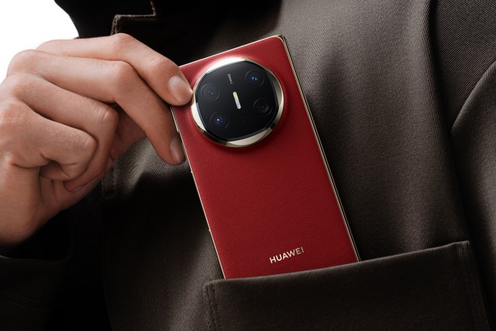 A promotional image showing a person holding the Huawei Mate X6.