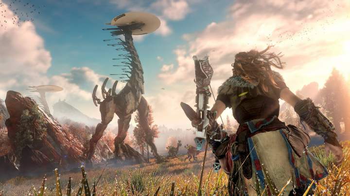 alt text for Aloy running towards a Tallneck with her bow and arrow.