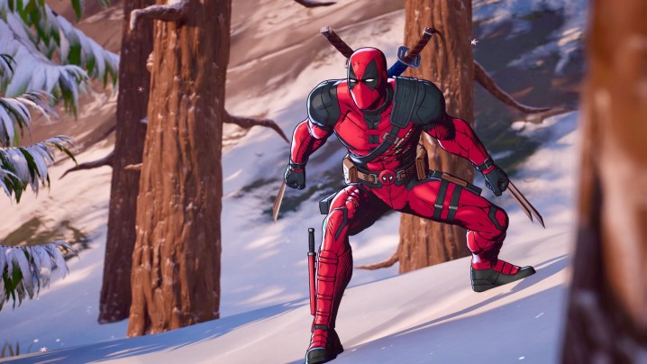 Deadpool battles in a forest in Fortnite.