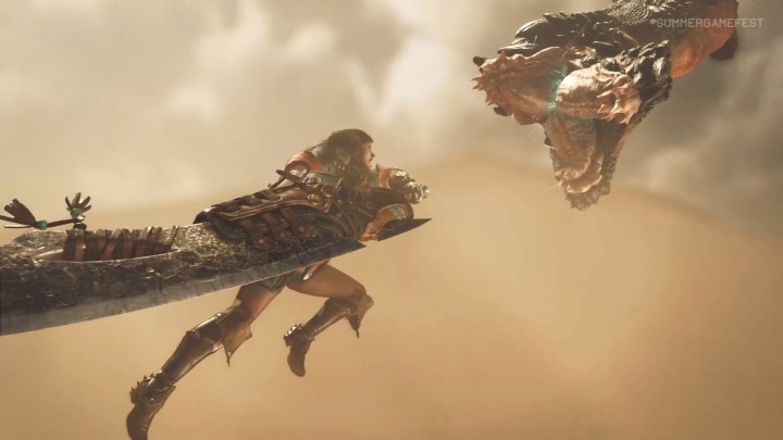 A hunter leaps at a Monster in Monster Hunter Wilds.