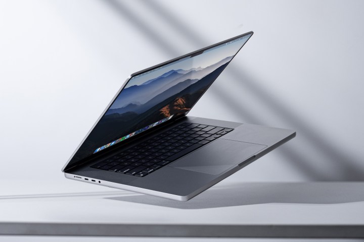 The Apple MacBook Pro 14 laptop propped up at an angle on a desk.