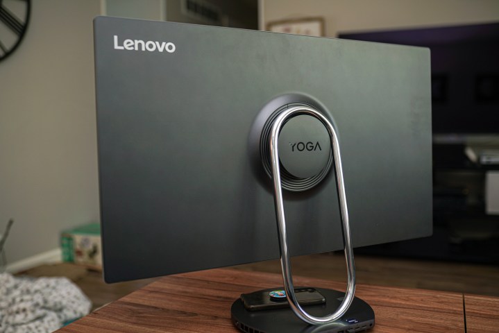 The back of the Lenovo Yoga AIO 9i showcasing its unique stand and circular Yoga badge.