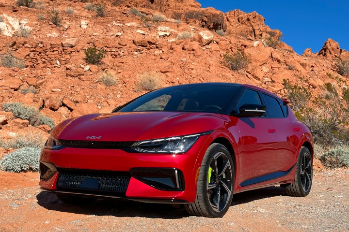 Front three-quarters view of a 2023 Kia EV6 GT in a desert setting.