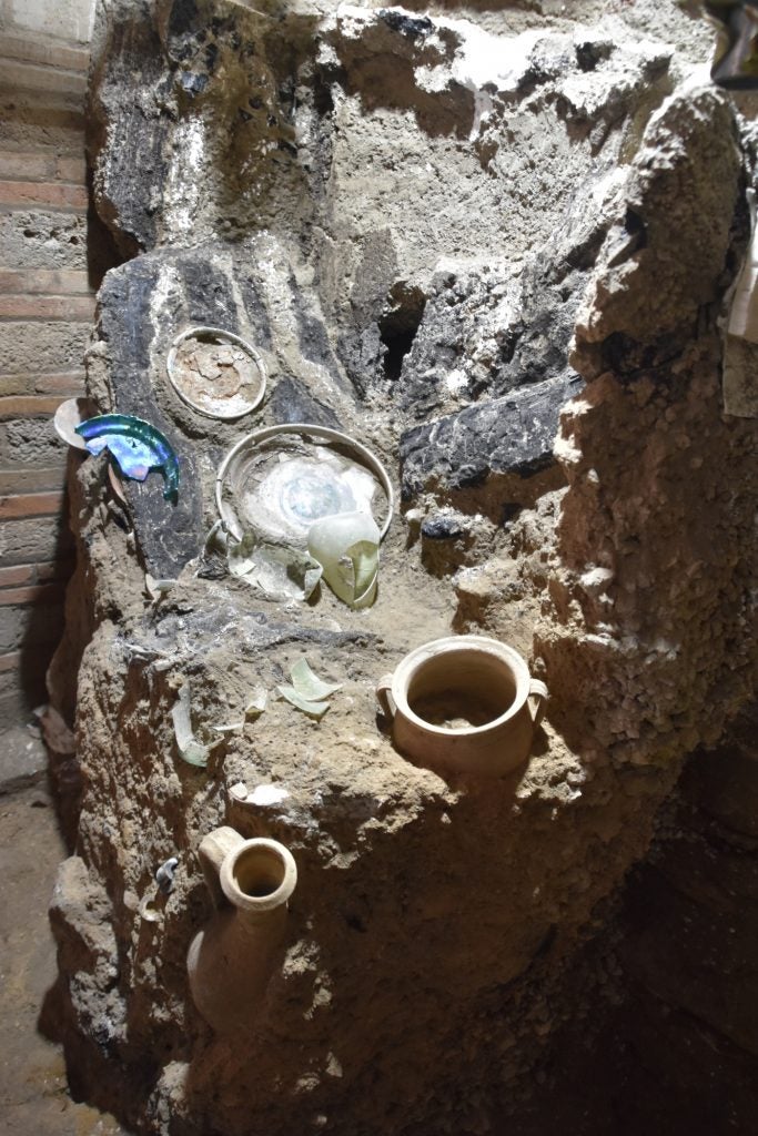 A view of the excavated rooms at the House of the Lararium in Pompeii, showing remnants of daily life.