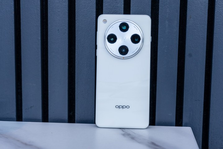 The back of the White Oppo Find X8 Pro against a blue background