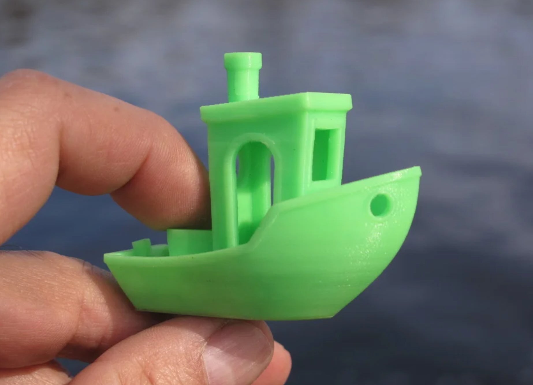 A microscopic 3D-printed Benchy tugboat.