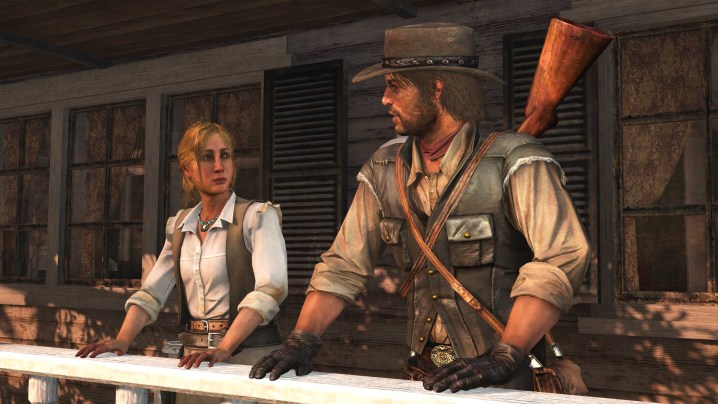 John Marston standing and talking with a woman with a rifle on his back.