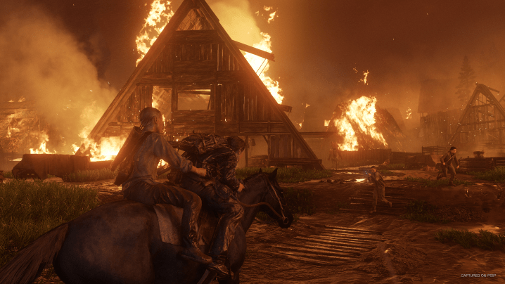 A house burns in The Last of Us Part 2 Remastered.