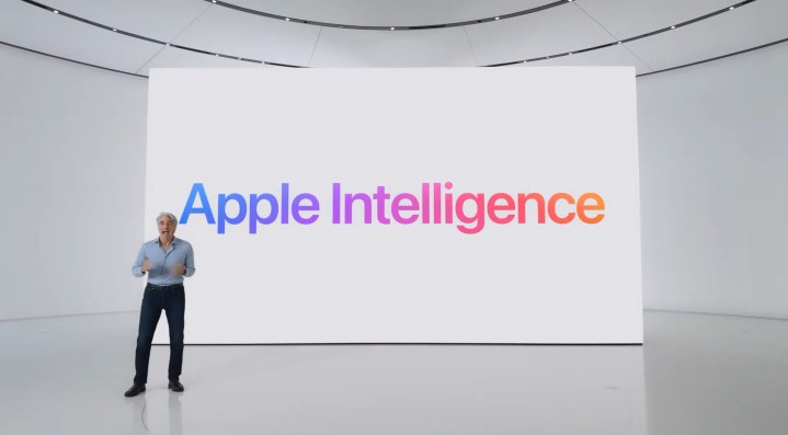 Craig in front of a screen reading Apple Intelligence